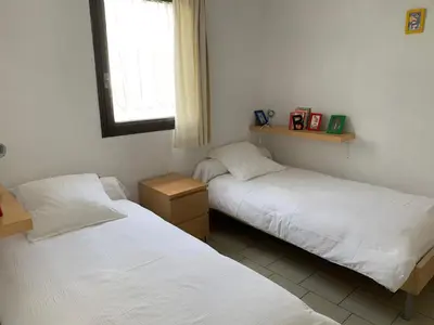 Un ou plusieurs lits dans un hébergement de l'établissement Pied à terre pour des vacances au bord de la mer
