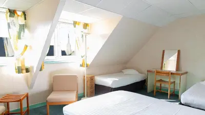 Un ou plusieurs lits dans un hébergement de l'établissement Les Bains de Mer Riviera Bretonne