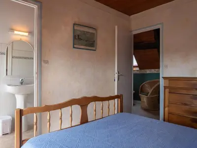 Un ou plusieurs lits dans un hébergement de l'établissement Holiday Home Manoir des Halles by Interhome