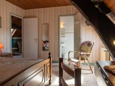 Un ou plusieurs lits dans un hébergement de l'établissement Holiday Home Manoir des Halles by Interhome
