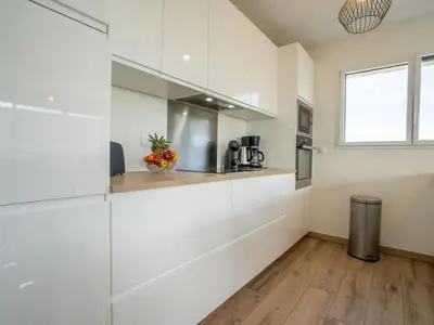Cuisine ou kitchenette dans l'établissement Holiday Home Les Dunes by Interhome