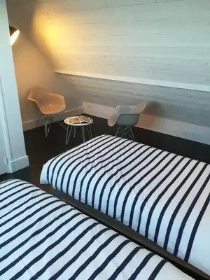 Un ou plusieurs lits dans un hébergement de l'établissement TY KERLUZ - Vue Mer et Plage à 80m