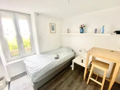 Un ou plusieurs lits dans un hébergement de l'établissement Studios meublés Brest Keruscun