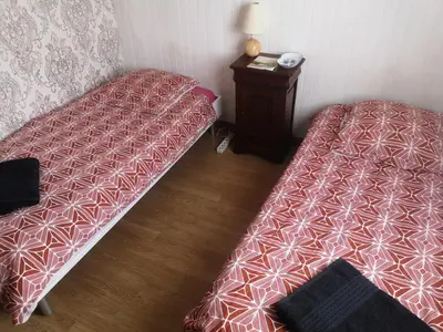 Un ou plusieurs lits dans un hébergement de l'établissement Chambre au calme et simple, cuisine à dispo