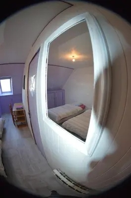 Un ou plusieurs lits dans un hébergement de l'établissement Chambre au calme et simple, cuisine à dispo