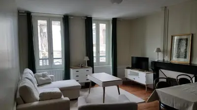 Télévision ou salle de divertissement dans l'établissement Appart'hotel de la Mairie