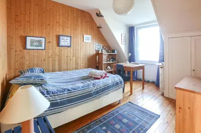 Un ou plusieurs lits dans un hébergement de l'établissement CABESTAN - Maison de famille au coeur du bourg - Vue Mer