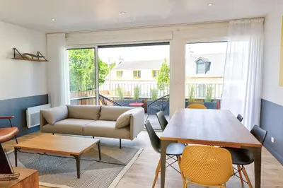 Coin salon dans l'établissement Résidence du Phare - 4 appartements - 2 chambres - Vue mer ou Terrasse