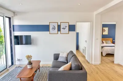 Télévision ou salle de divertissement dans l'établissement Résidence du Phare - 4 appartements - 2 chambres - Vue mer ou Terrasse