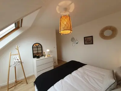 Un ou plusieurs lits dans un hébergement de l'établissement Gîte Ty Rosanès proche de la mer