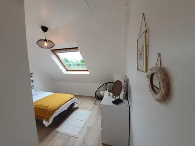 Un ou plusieurs lits dans un hébergement de l'établissement Gîte Ty Rosanès proche de la mer