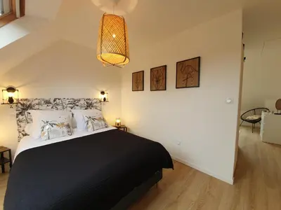 Un ou plusieurs lits dans un hébergement de l'établissement Gîte Ty Rosanès proche de la mer
