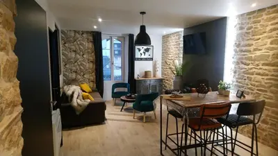Coin salon dans l'établissement appartement topaze