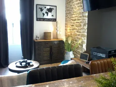 Télévision ou salle de divertissement dans l'établissement appartement topaze
