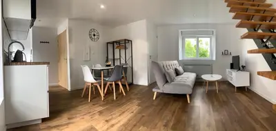 Coin salon dans l'établissement Duplex calme et cosy