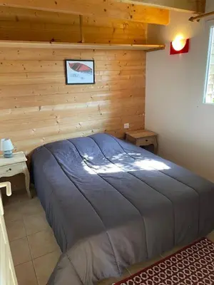 Un ou plusieurs lits dans un hébergement de l'établissement Camping les vergers de Squividan ***