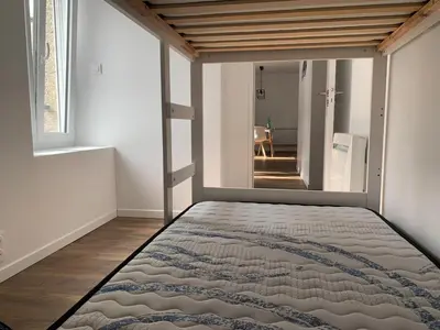 Un ou plusieurs lits dans un hébergement de l'établissement Appartement calme et chaleureux
