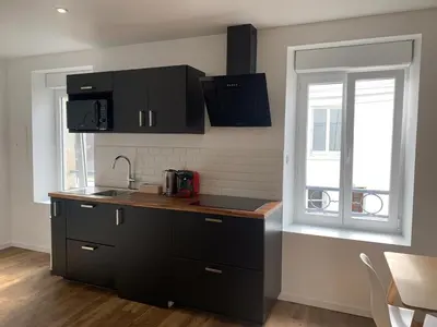 Cuisine ou kitchenette dans l'établissement Appartement calme et chaleureux