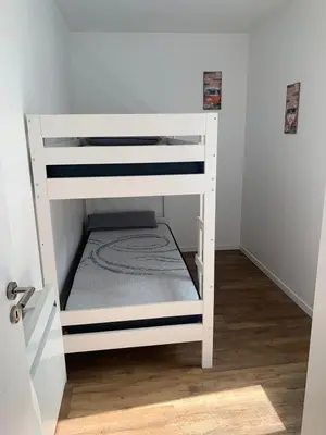 Un ou plusieurs lits dans un hébergement de l'établissement Appartement calme et chaleureux