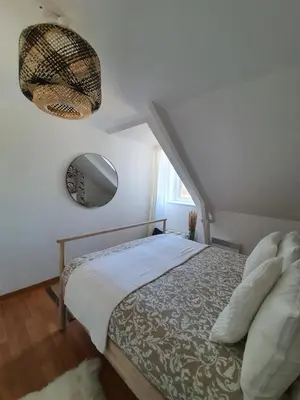 Un ou plusieurs lits dans un hébergement de l'établissement Bord de Mer l'Appartement à Loctudy