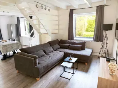 Coin salon dans l'établissement Gite Les Sables Blancs