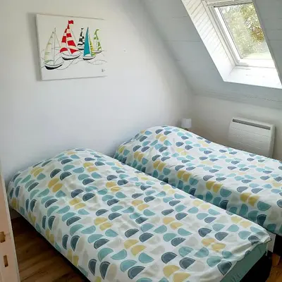 Un ou plusieurs lits dans un hébergement de l'établissement Gite Les Sables Blancs