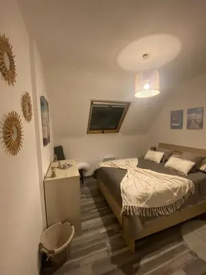 Un ou plusieurs lits dans un hébergement de l'établissement Maison à 20 mètre de la plage vue sur Mer