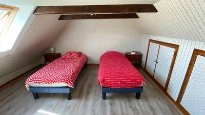 Un ou plusieurs lits dans un hébergement de l'établissement Charmante Maison Bretonne à 2 minutes des plages