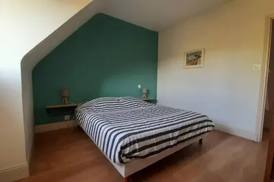 Un ou plusieurs lits dans un hébergement de l'établissement Gîte de charme 14 personnes labellisé Clévacances 3 étoiles