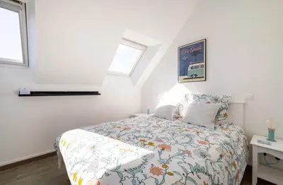 Un ou plusieurs lits dans un hébergement de l'établissement CAP COZ Sea Side FOUESNANT