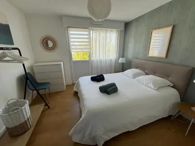 Un ou plusieurs lits dans un hébergement de l'établissement Appartement vue mer