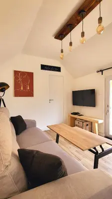 Télévision ou salle de divertissement dans l'établissement KerLudi Le Ptit St Roch, gîte de charme 5km de la mer