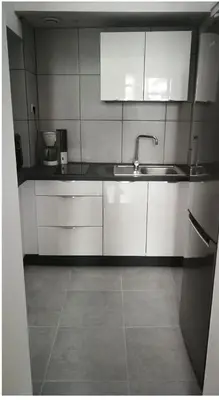 Cuisine ou kitchenette dans l'établissement Grand appartement près de la Cathédrale de Quimper