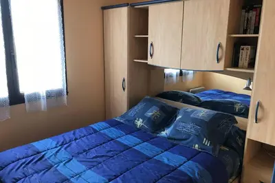 Un ou plusieurs lits dans un hébergement de l'établissement PENMARC’H KERITY location face à la mer