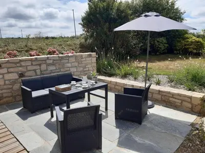 Coin salon dans l'établissement Stone House in Plouescat near Sandy Beaches