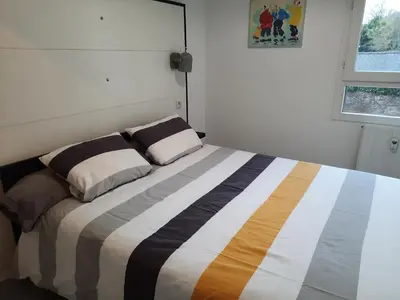 Un ou plusieurs lits dans un hébergement de l'établissement La Poterie - Appartement avec balcon et parking privé