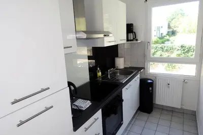 Cuisine ou kitchenette dans l'établissement La Poterie - Appartement avec balcon et parking privé