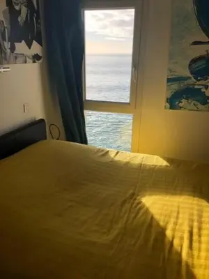 Un ou plusieurs lits dans un hébergement de l'établissement Appartement cosy les pieds dans l’eau, vue mer exceptionnelle