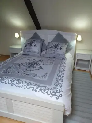 Un ou plusieurs lits dans un hébergement de l'établissement LA PETITE MAISON DU SABOT