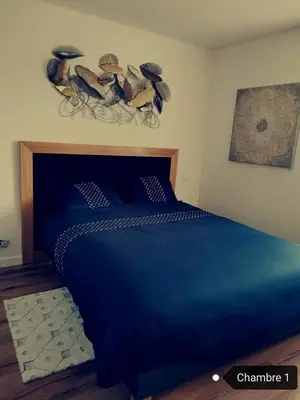 Un ou plusieurs lits dans un hébergement de l'établissement Loft 100m2 neuf entièrement équipée