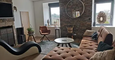 Coin salon dans l'établissement Loft 100m2 neuf entièrement équipée