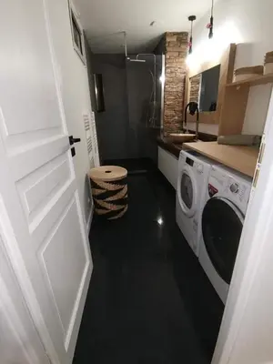 Cuisine ou kitchenette dans l'établissement Loft 100m2 neuf entièrement équipée