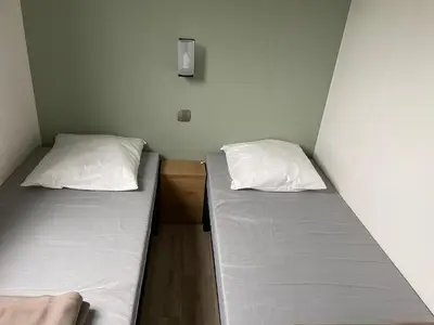 Un ou plusieurs lits dans un hébergement de l'établissement Mobilhome tout confort R10 domaine de lanniron