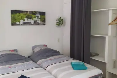 Un ou plusieurs lits dans un hébergement de l'établissement 12 RDC Appartement 2 chambres jardin terrasse