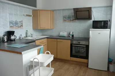 Cuisine ou kitchenette dans l'établissement 12 RDC Appartement 2 chambres jardin terrasse