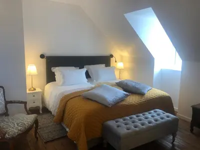 Un ou plusieurs lits dans un hébergement de l'établissement L'Otentik Restaurant Chambres d'Hôtes
