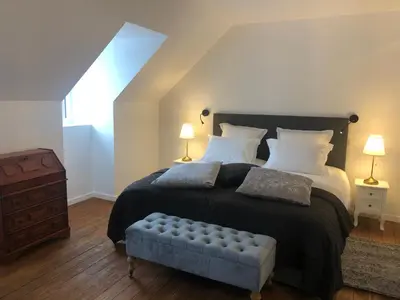 Un ou plusieurs lits dans un hébergement de l'établissement L'Otentik Restaurant Chambres d'Hôtes