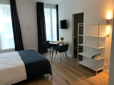 Un ou plusieurs lits dans un hébergement de l'établissement TY STUDIOS Hyper Centre Ville
