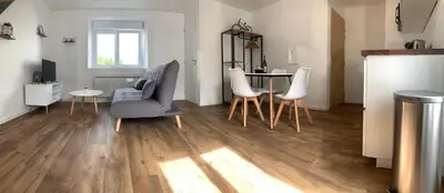 Coin salon dans l'établissement Duplex calme et cosy II