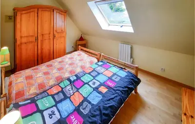 Un ou plusieurs lits dans un hébergement de l'établissement Cozy Home In Kerlouan With Wifi